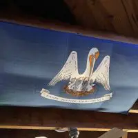 Corporation Bar - New Orleans Dive Bar - Ceiling Flag